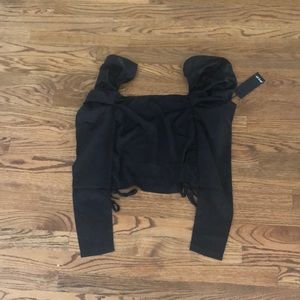 A Black Satin Cropped Blouse with high shoulders